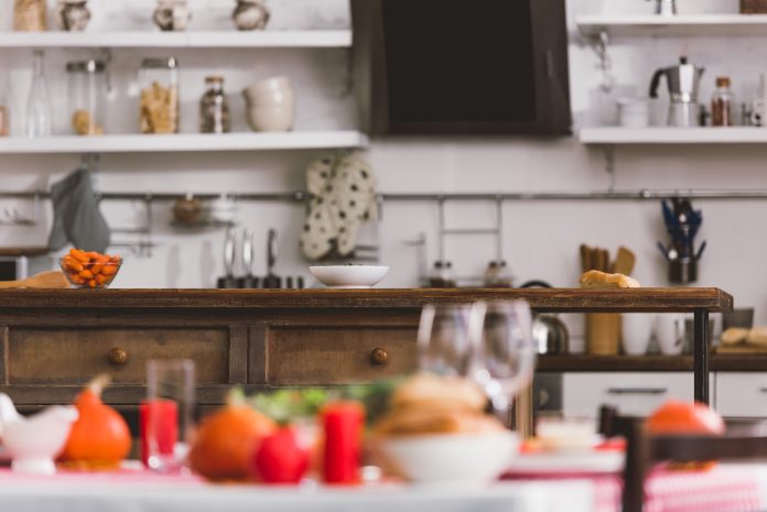 selective focus of table with carrot and bowl in Thanksgiving day